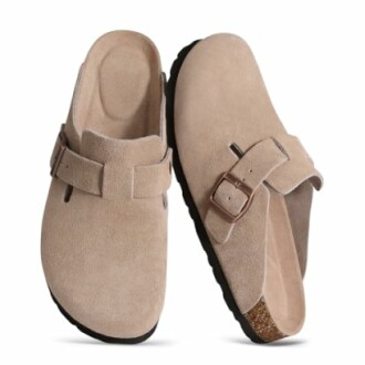 Beige suede slip-on sandals with buckles.