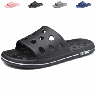 Black slip-on sandal with perforated design and brand logo