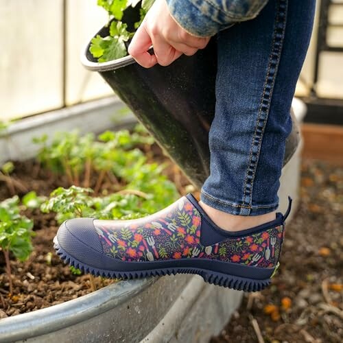 Person wearing floral garden shoes while planting